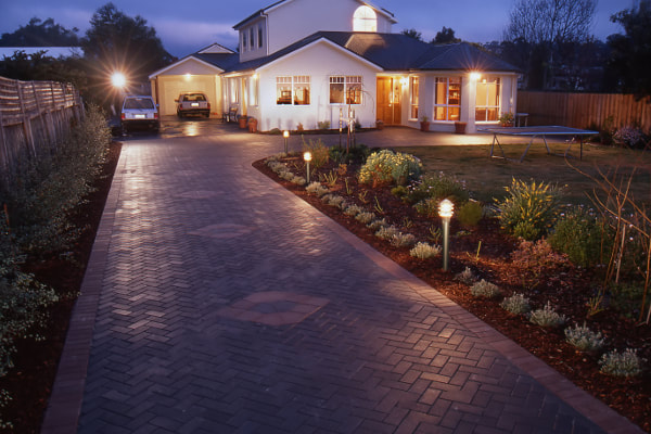 New paver driveway with unique patterns and trim